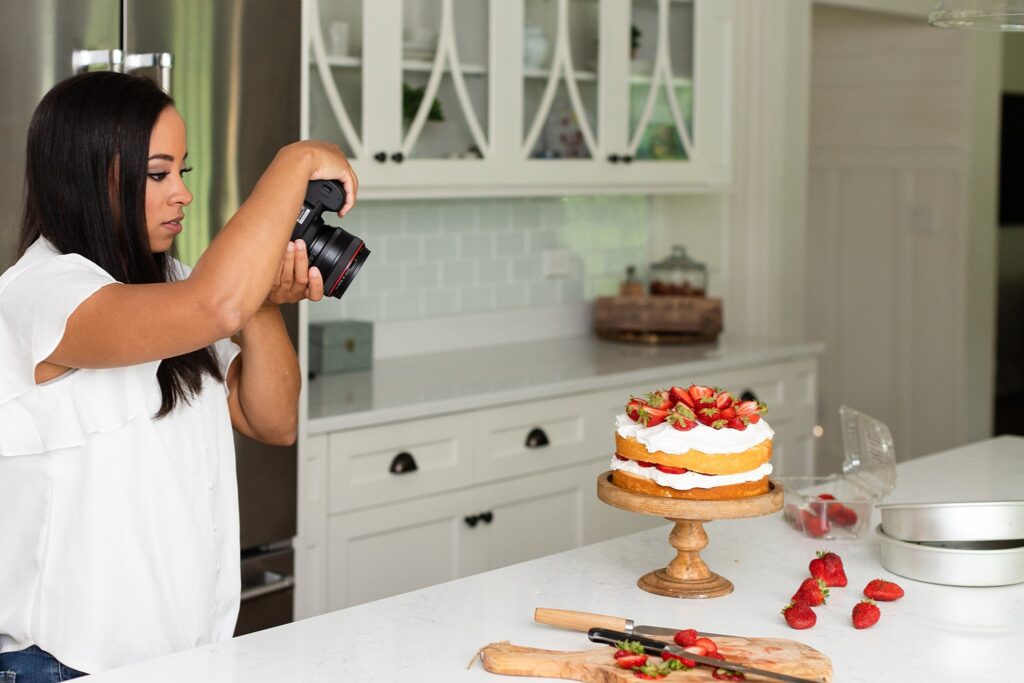 food photographer takes photo of strawberry shortcake, branding imagesfor a food photographer