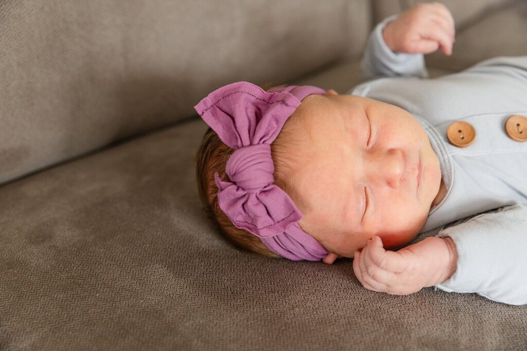 newborn baby girl on couch