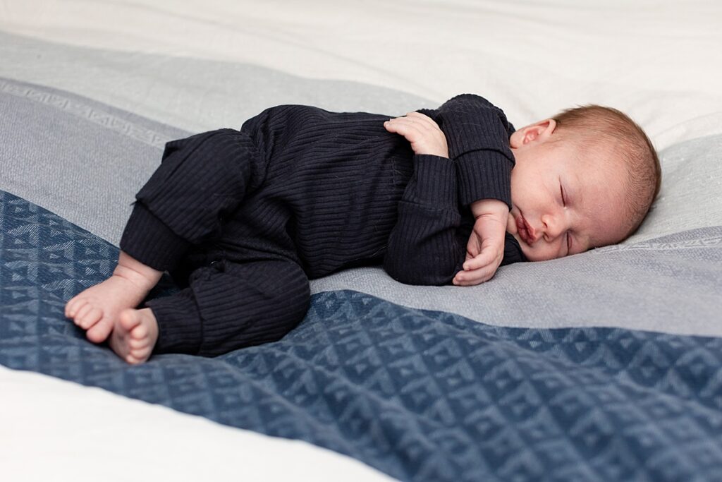 newborn photo, newborn boy, in-home lifestyle session, newborn on bed, navy and blue newborn session, Newborn Photographer, Darien Newborn Photographer
