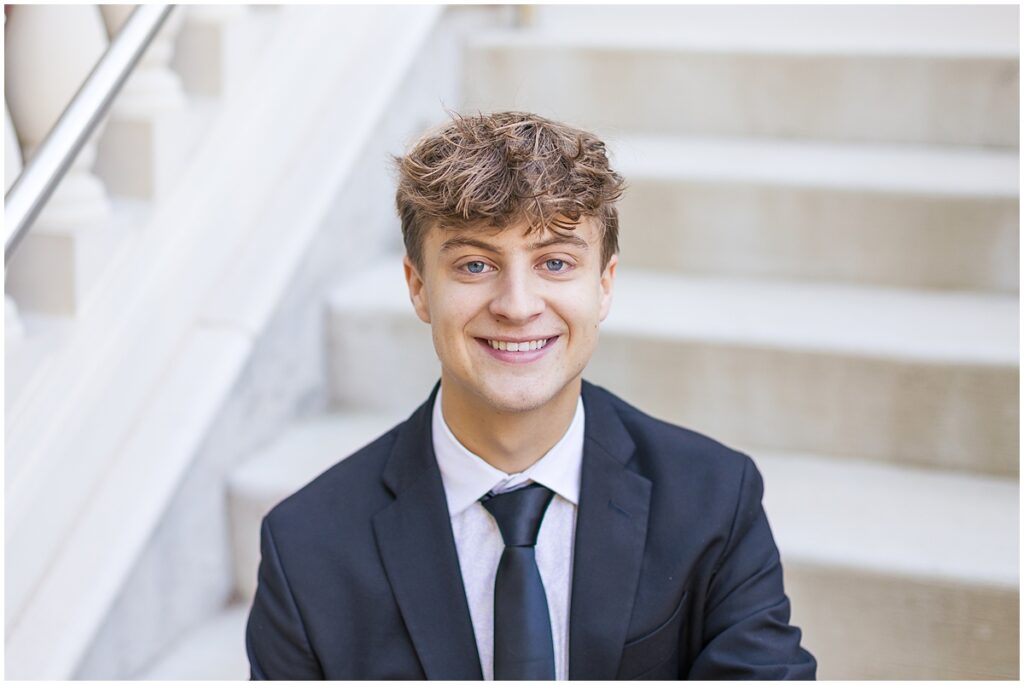 clean white stairs with male in suit