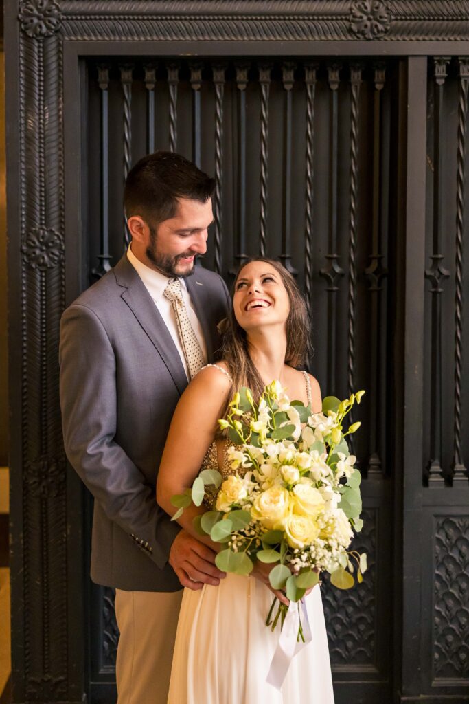 Couple looking at each other in wedding photos at the Chicago Cultural Center