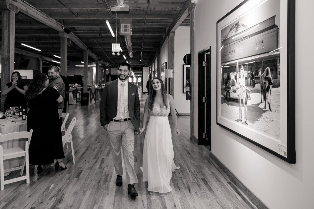 Bride and groom entrance black and white photo at Morgan Arts Complex