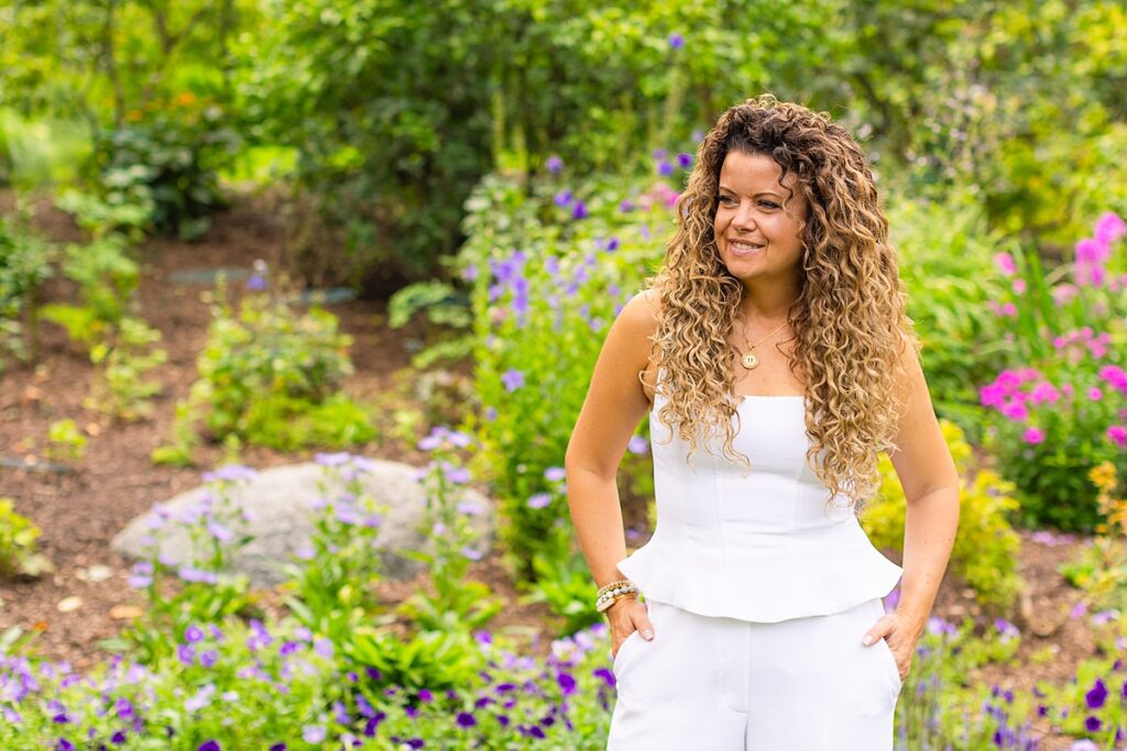 Adored Salon owner, Jen, posing in Lilacia Park in early summer for brand photos
