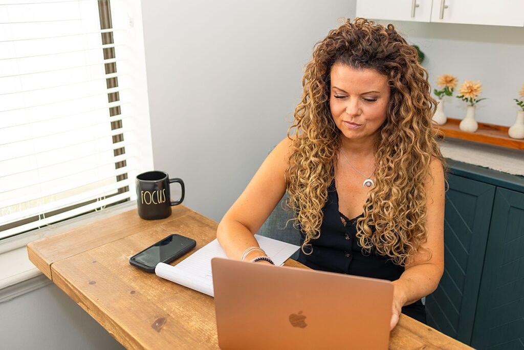 woman business owner sitting at desk working
