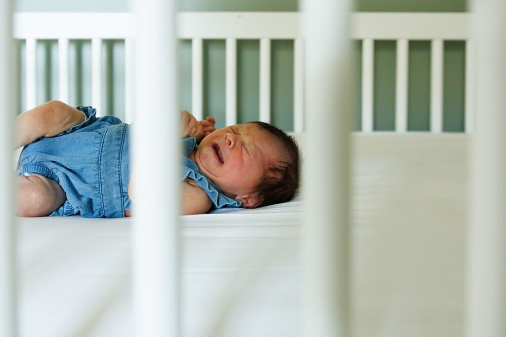 Newborn Baby in Crib