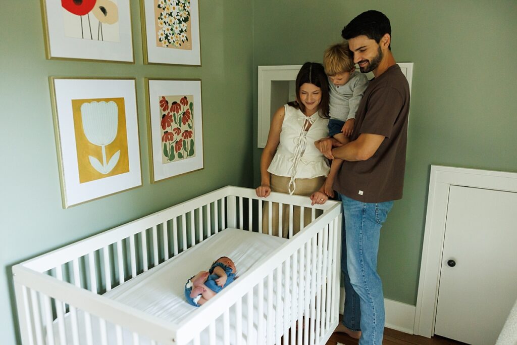 Nursery Photo of looking at crib with newborn